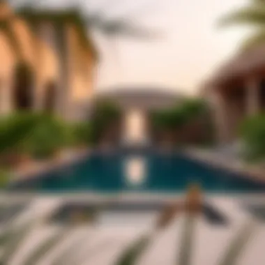 Serene Pool Area in Damac Villa Serene pool area of a Damac villa surrounded by lush greenery