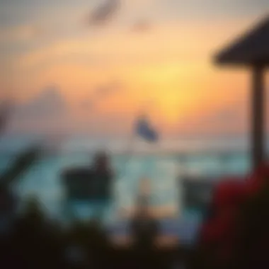 Serene sunset view from the terrace of a water villa overlooking the ocean.